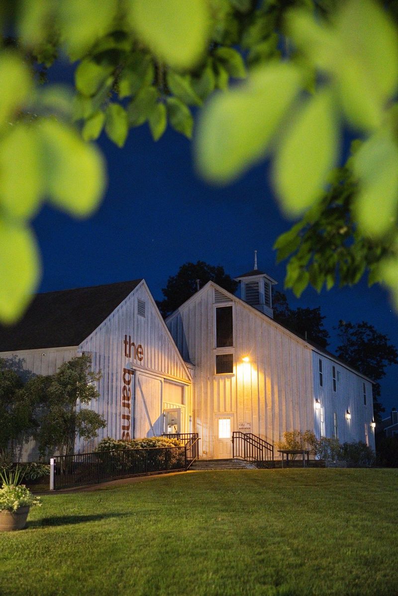The illuminated Barns at Wesleyan Hills exterior at night