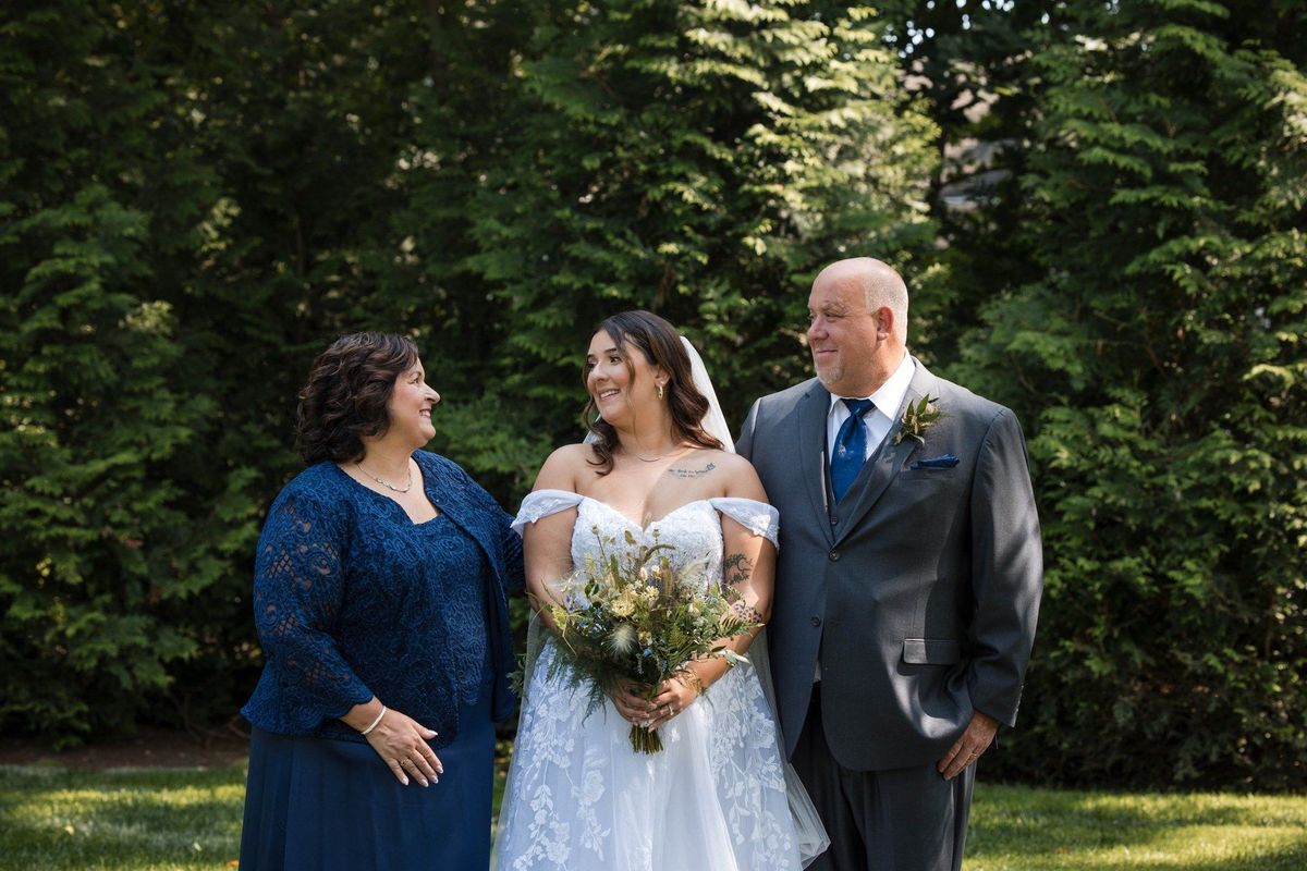 Sophia shares a smiling garden portrait with two companions