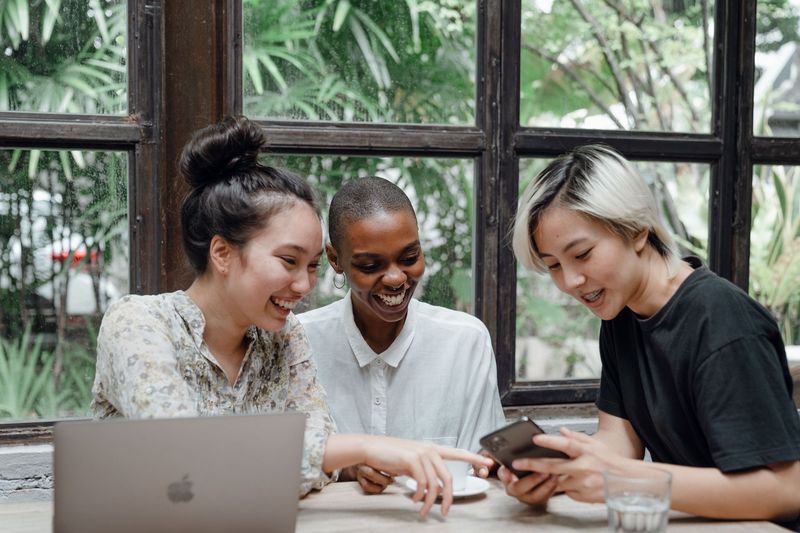 Three professionals laughing together