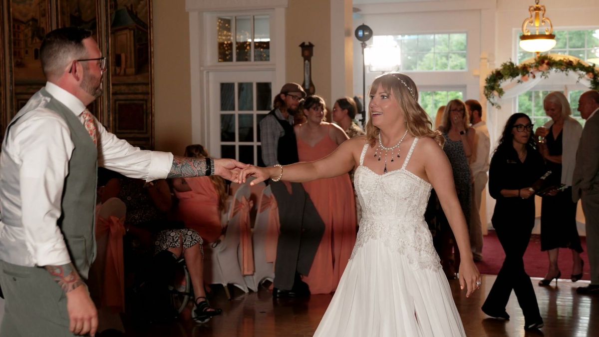Tyler and Sara dance together indoors