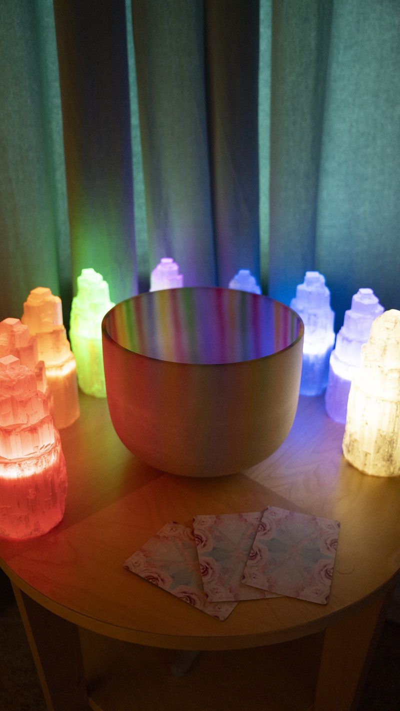 Colored translucent objects and a bowl arranged on a small round table