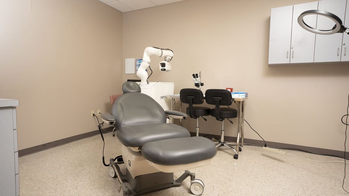 Treatment chair and equipment in a neutral-toned room