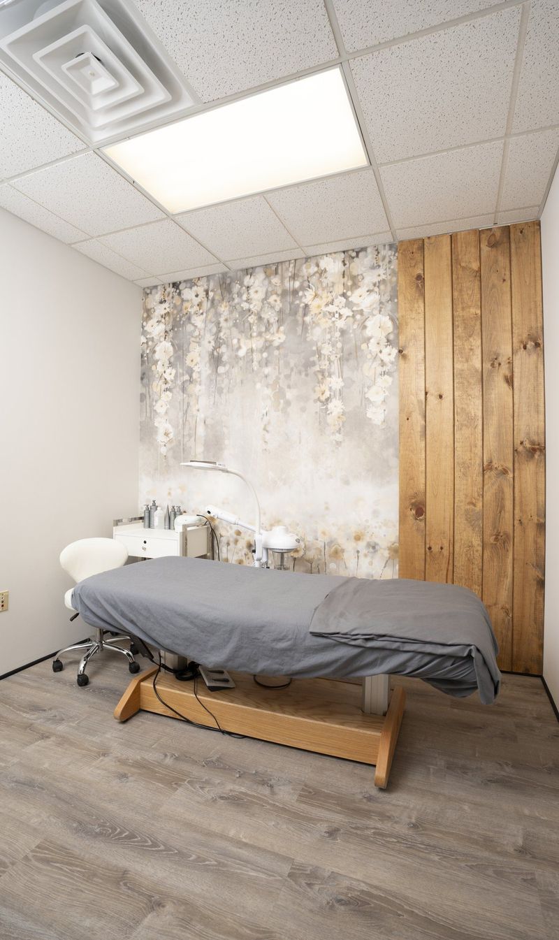 Treatment bed in a room with a floral accent wall