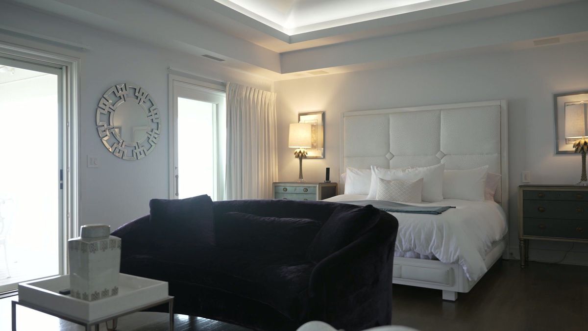Bedroom seating and windows inside the waterfront home