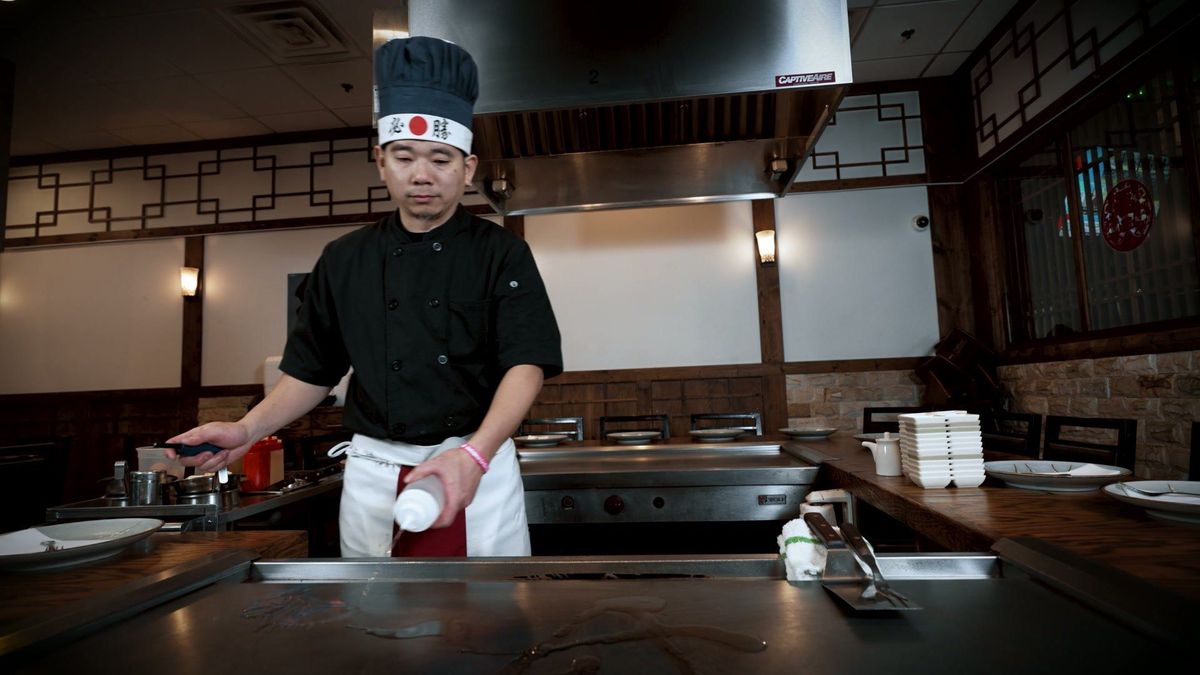 A chef presents at the Yume hibachi grill