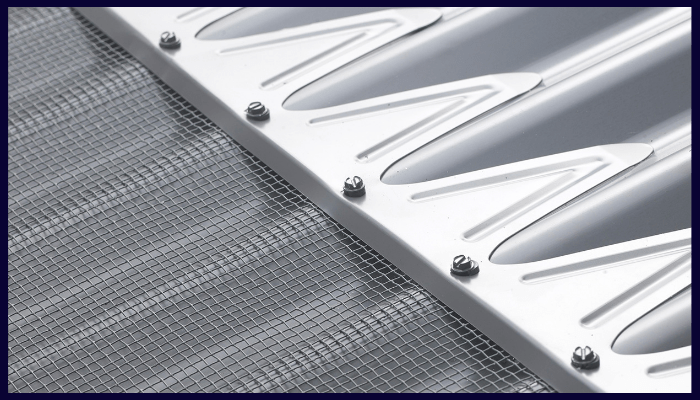 close-up of metal gutter guard mesh fixed to a roof