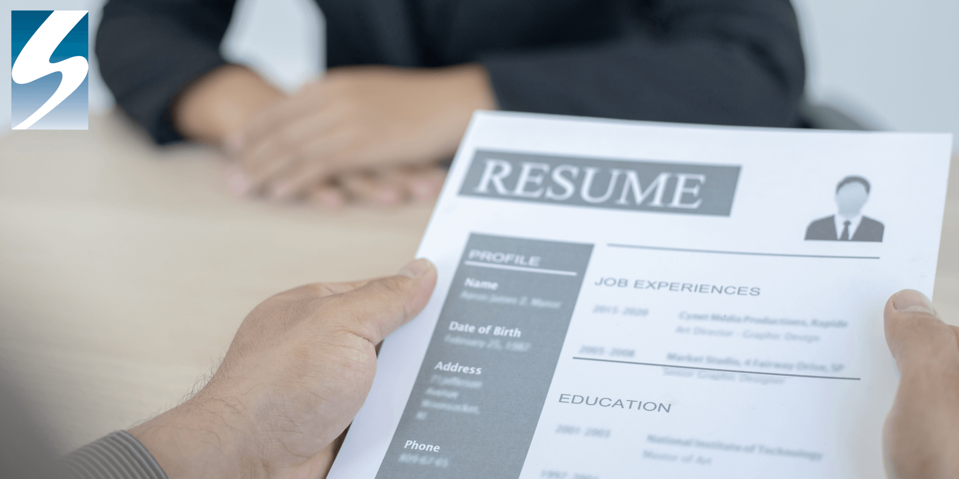 Person holding a resume