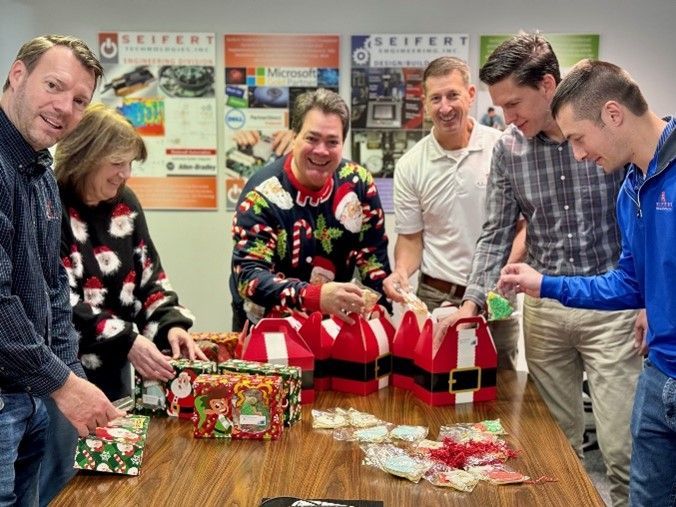Seifert employees filling boxes with goodies