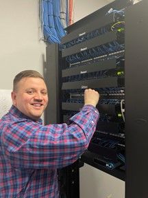 Josh Wozny working in the server room