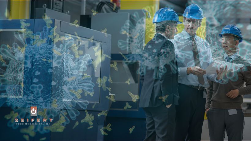 3 Men on Manufacturing floor with COVID Virus Overlayed