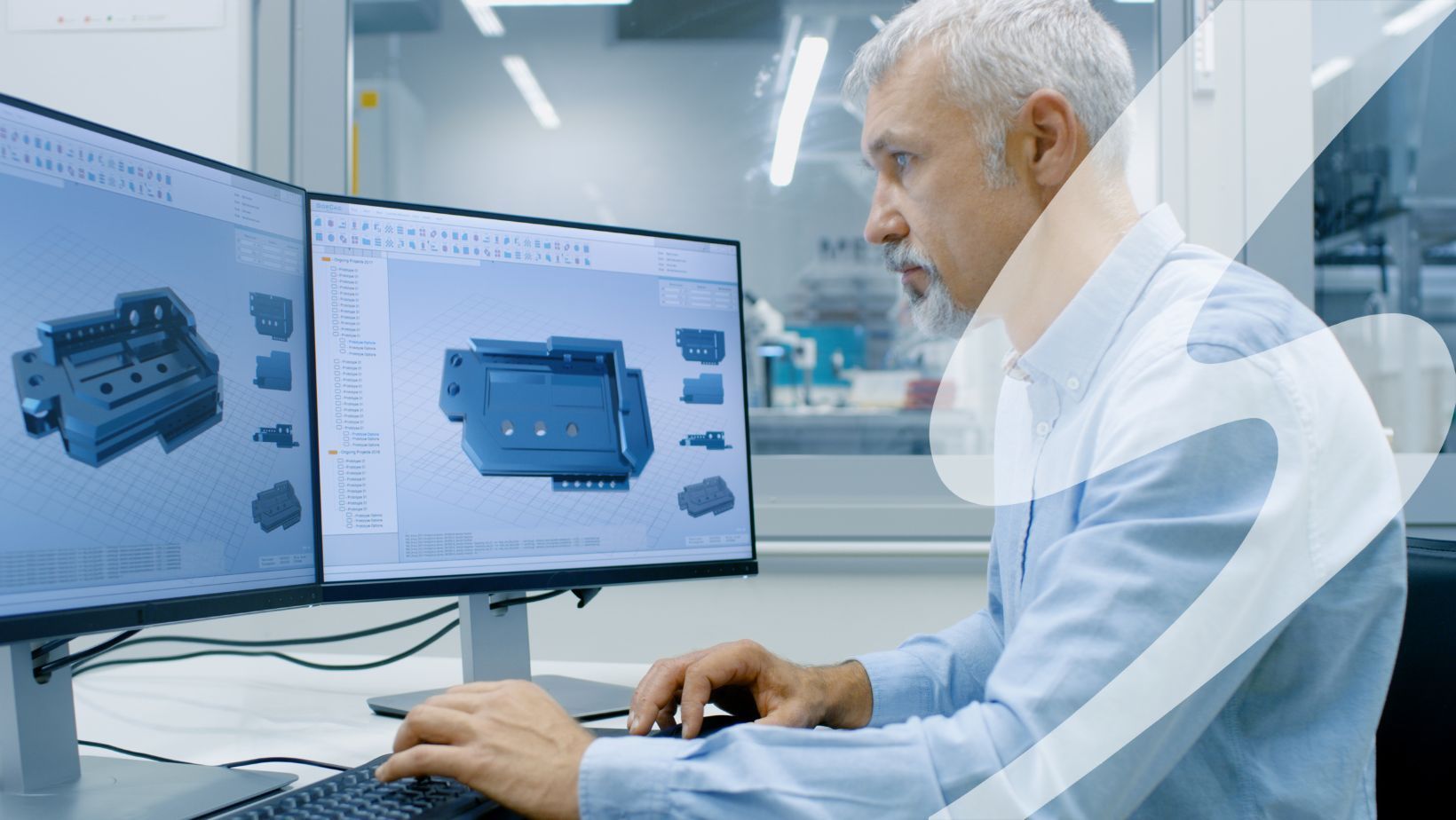 Person working in a CAD program on multiple computer screens.