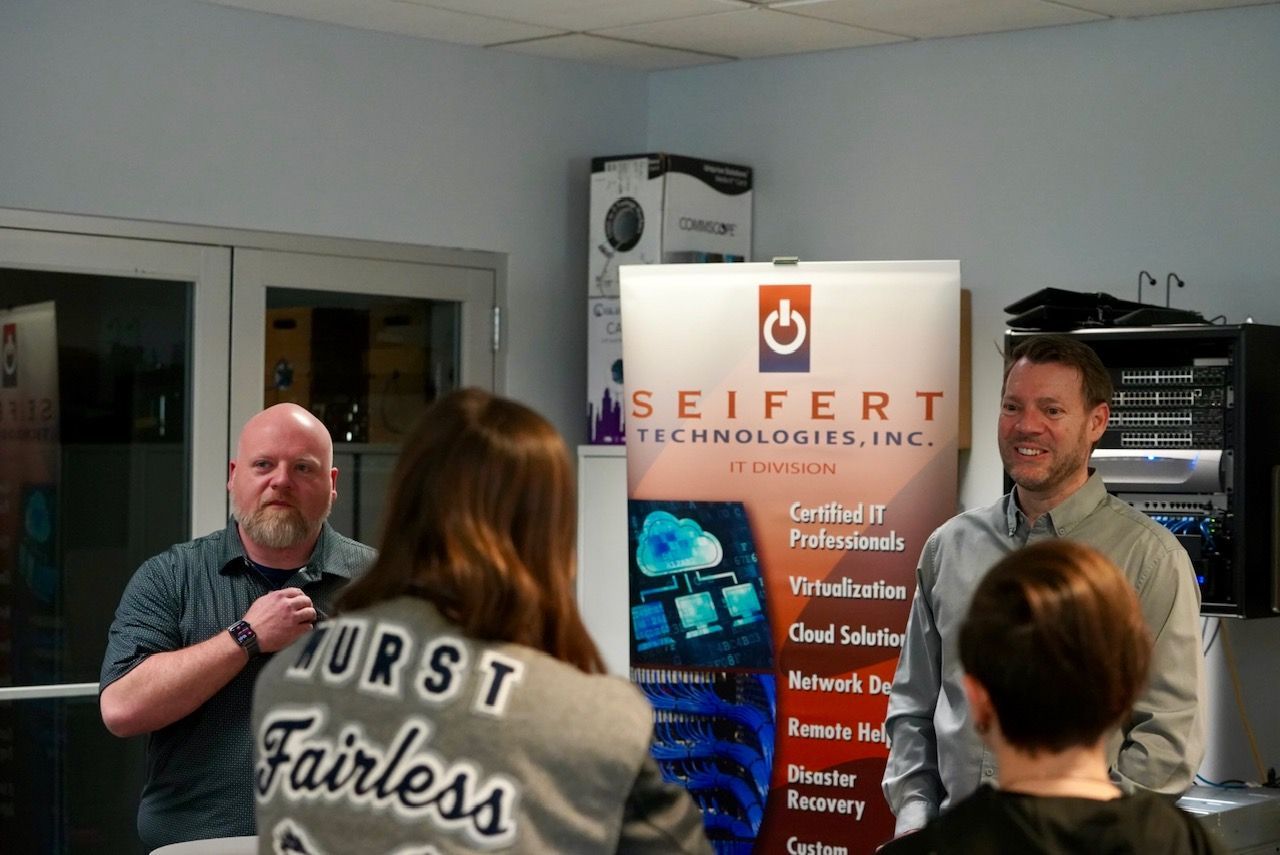 Seifert employees giving a presentation to students about Seifert