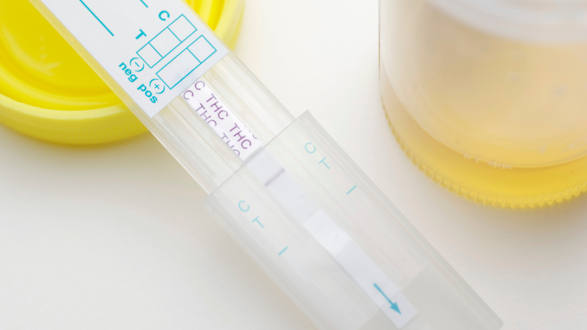 A urine drug test kit showing a line at the control (C) and test (T) positions, indicating a negative result for THC.
