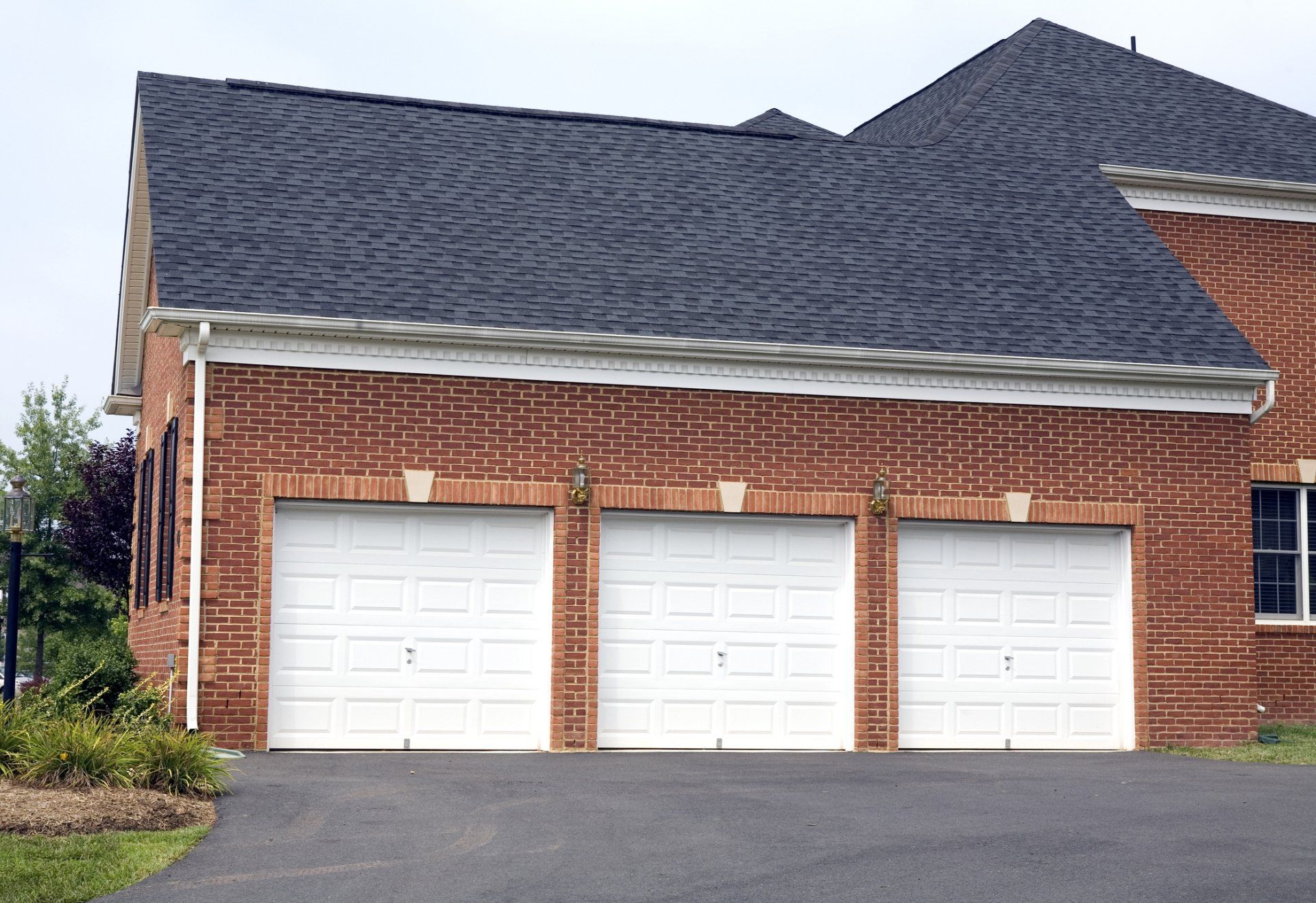 Holding a Garage Remote — Ann Arbor, MI — Ann Arbor Door Systems