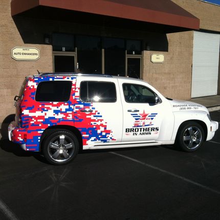 White SUV with red, white, and blue pixelated design, 