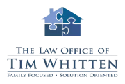 Logo for The Law Office of Tim Whitten featuring a house made of four puzzle pieces in blue shades and text below.