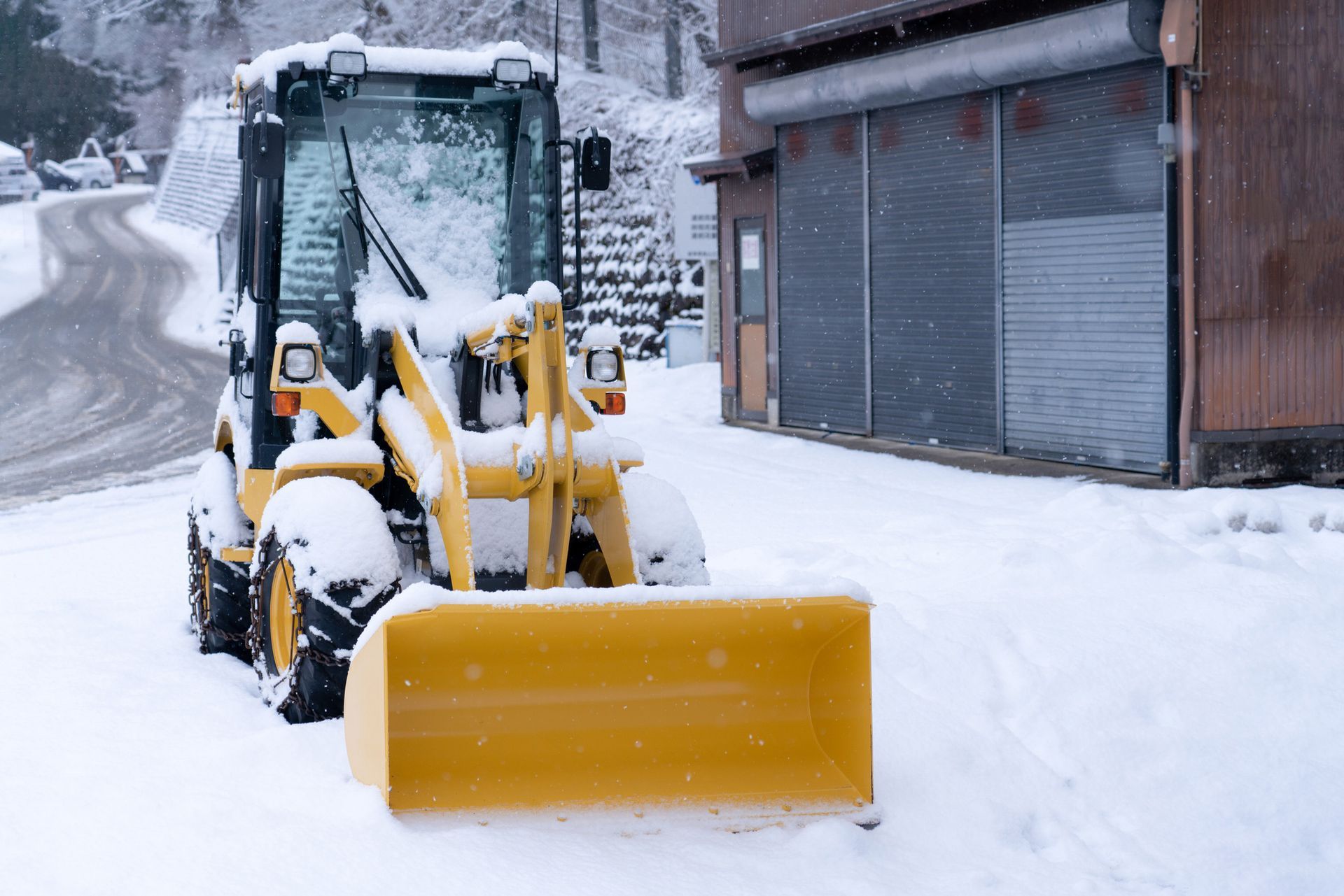 Snow Removal Vehicle Removing Snow — Bear, DE — Smith Paving & Contracting, Inc. Snow Removal Vehicle Removing Snow — Bear, DE — Smith Paving & Contracting, Inc.