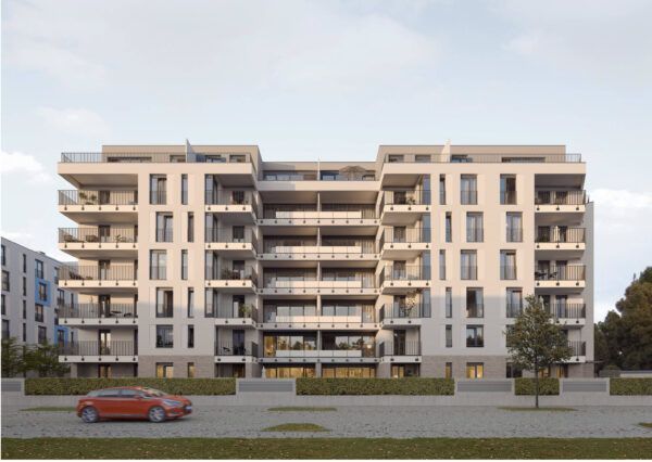 Ein rotes Auto steht vor einem großen Wohnhaus
