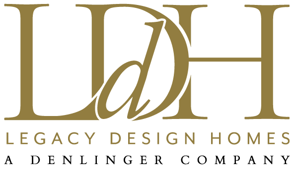 The logo for legacy design homes a denlinger company