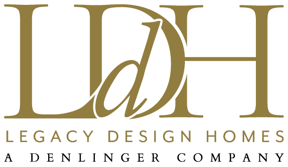 The logo for legacy design homes a denlinger company