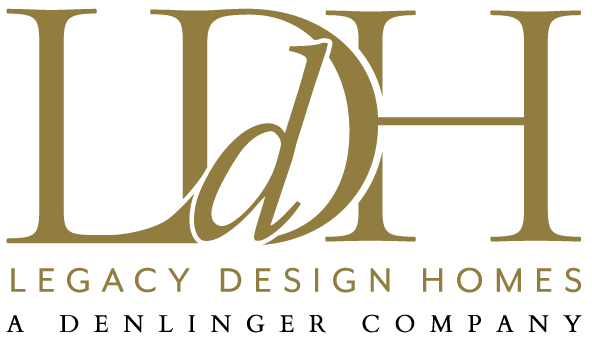 The logo for legacy design homes a denlinger company