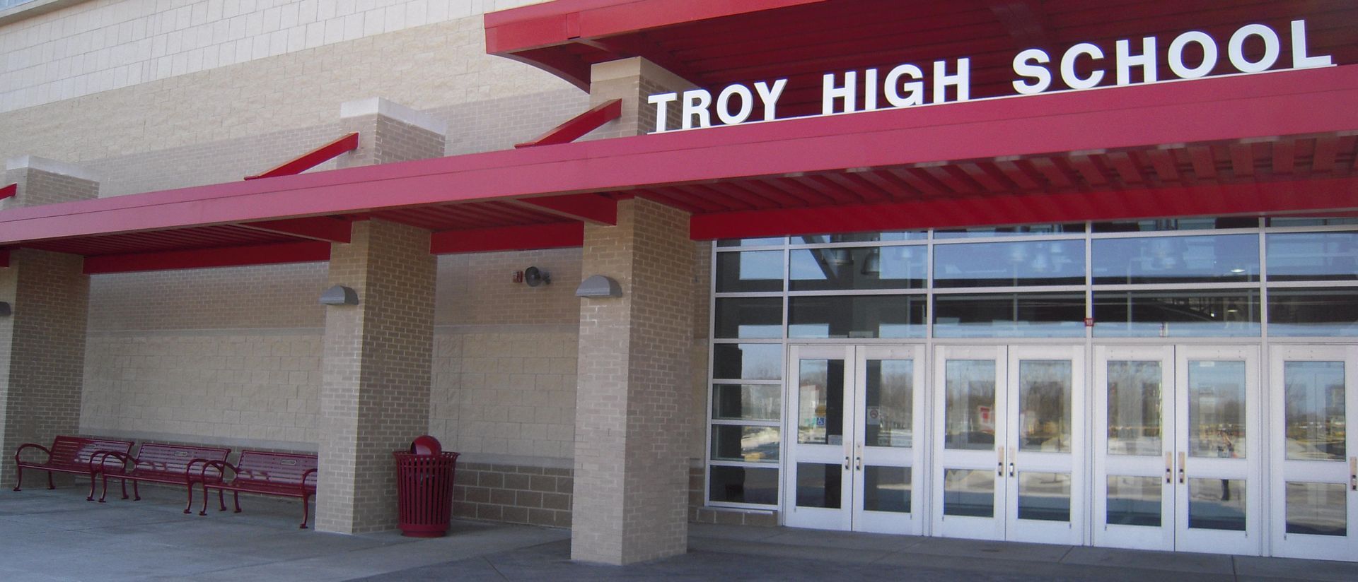 Troy high school has a red awning over the entrance