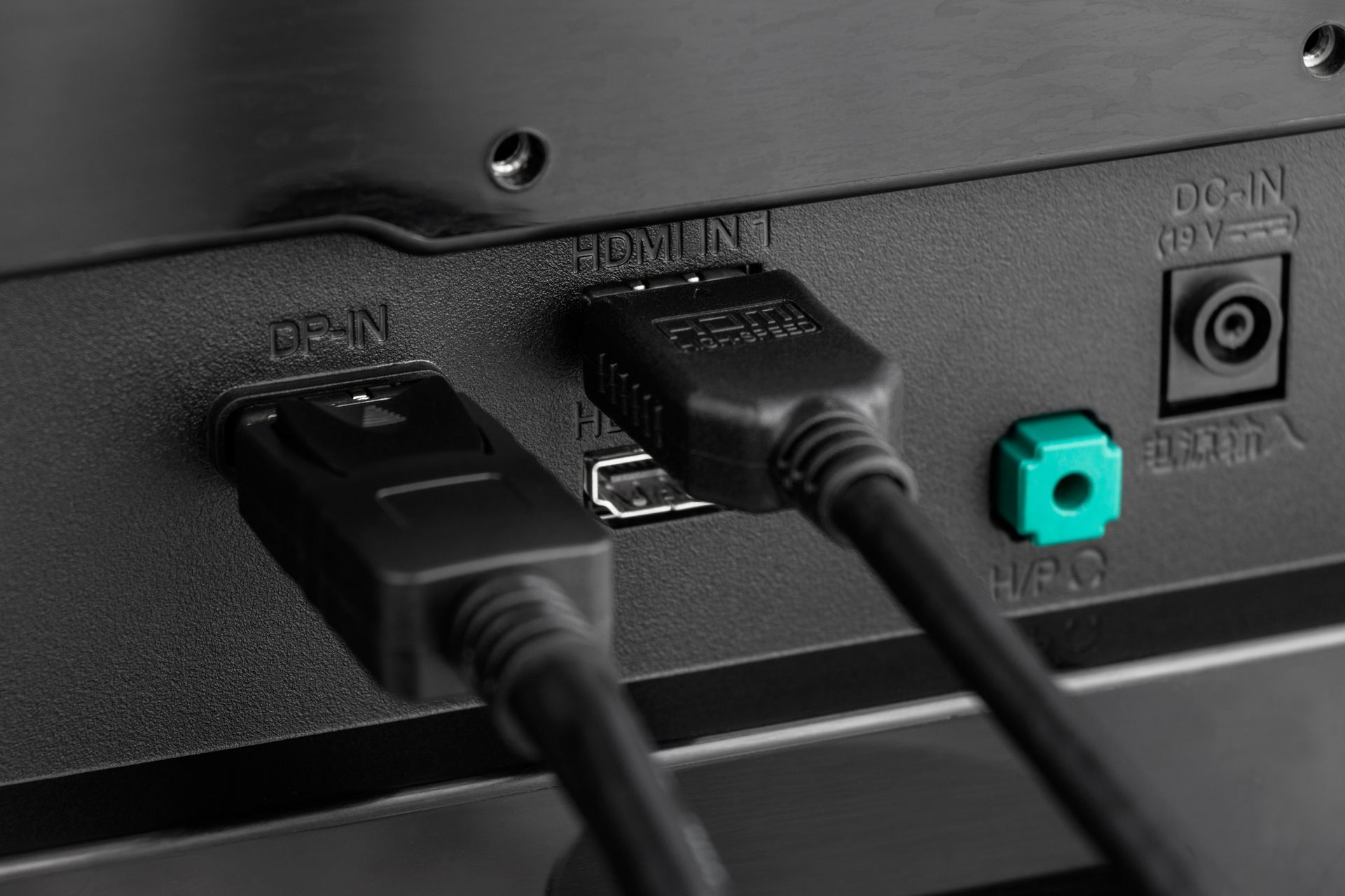 Close-up of monitor back panel with HDMI, DisplayPort, audio jack, and power connections for Audio Visual System Installation Washington IN