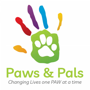 Colorful handprint with a paw print in the palm. Logo for "Paws & Pals". Text reads: "Changing Lives one PAW at a time".
