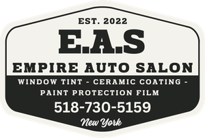 Black-and-white Empire Auto Salon logo with services and phone number 518-730-5159