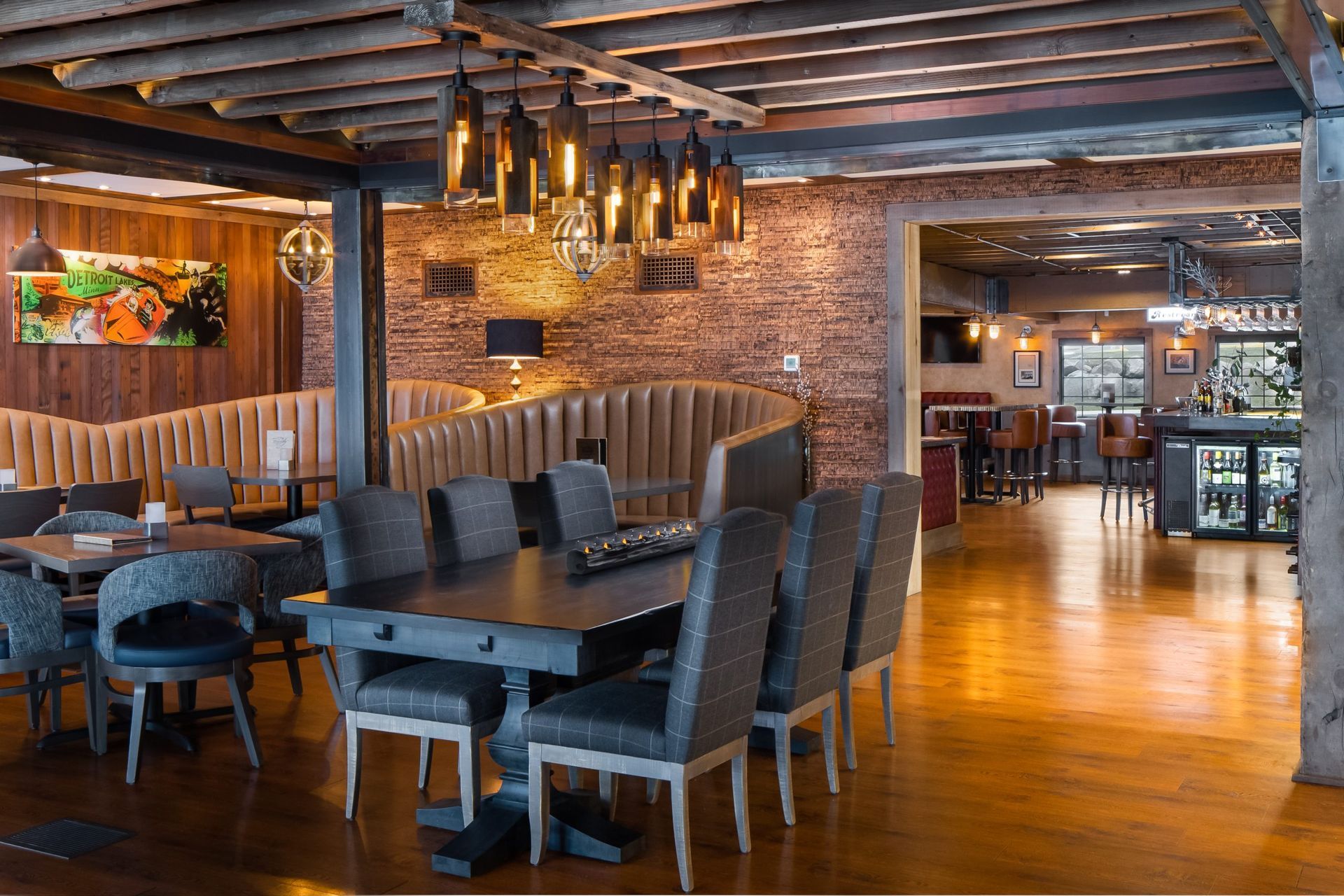 A large dining room with tables and chairs in a restaurant.