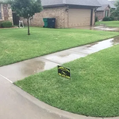 Veteran owned lawn care team at work in OKC