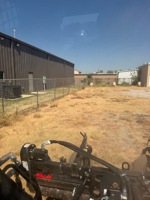 A brush clearing and excavation project with heavy equipment removing vegetation and preparing the land by Campbell and Sons