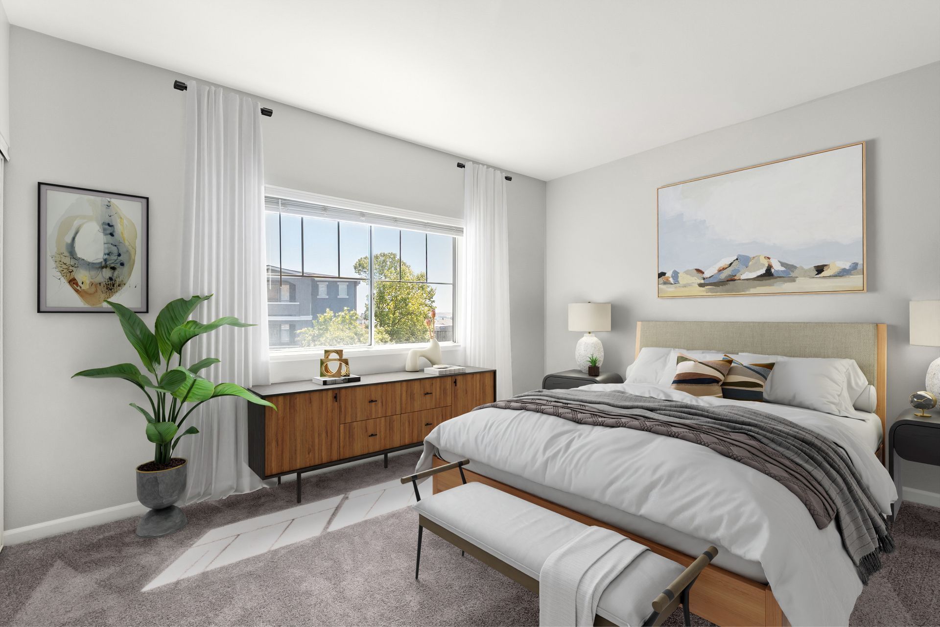 Bright bedroom with a gray bed, wood dresser, large window, and potted plant under a coastal painting