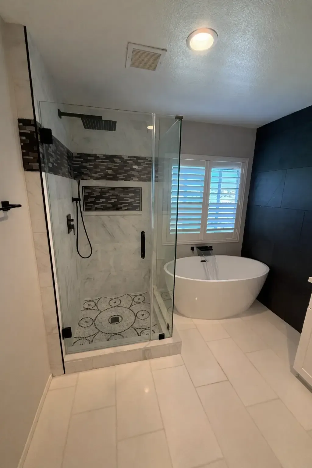 Walk-in glass shower with custom tile in an accessible Indianapolis bathroom remodel by Main Street Contractors