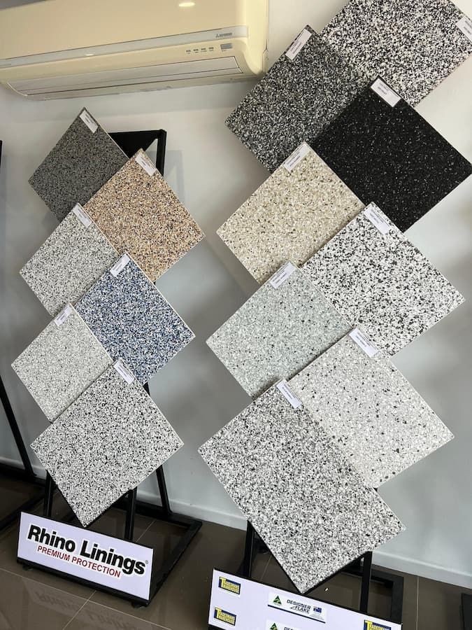 There Are Many Different Types of Tiles on Display on a Stand — Fraser Coast Waterproofing in Pialba, QLD