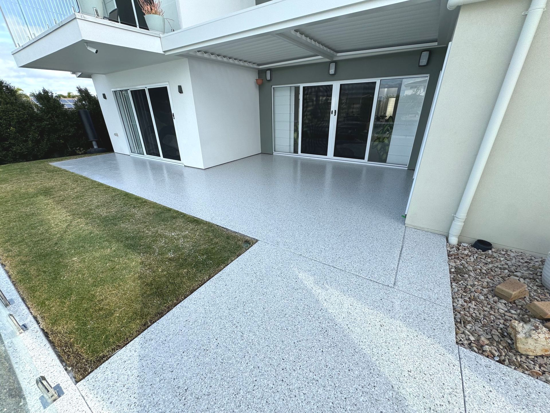 A Person Is Standing on A Roof with A Torch — Fraser Coast Waterproofing in Pialba, QLD