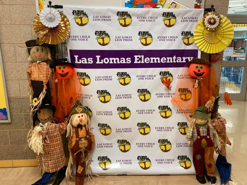 Halloween display at Las Lomas Elementary with scarecrow and pumpkin decorations