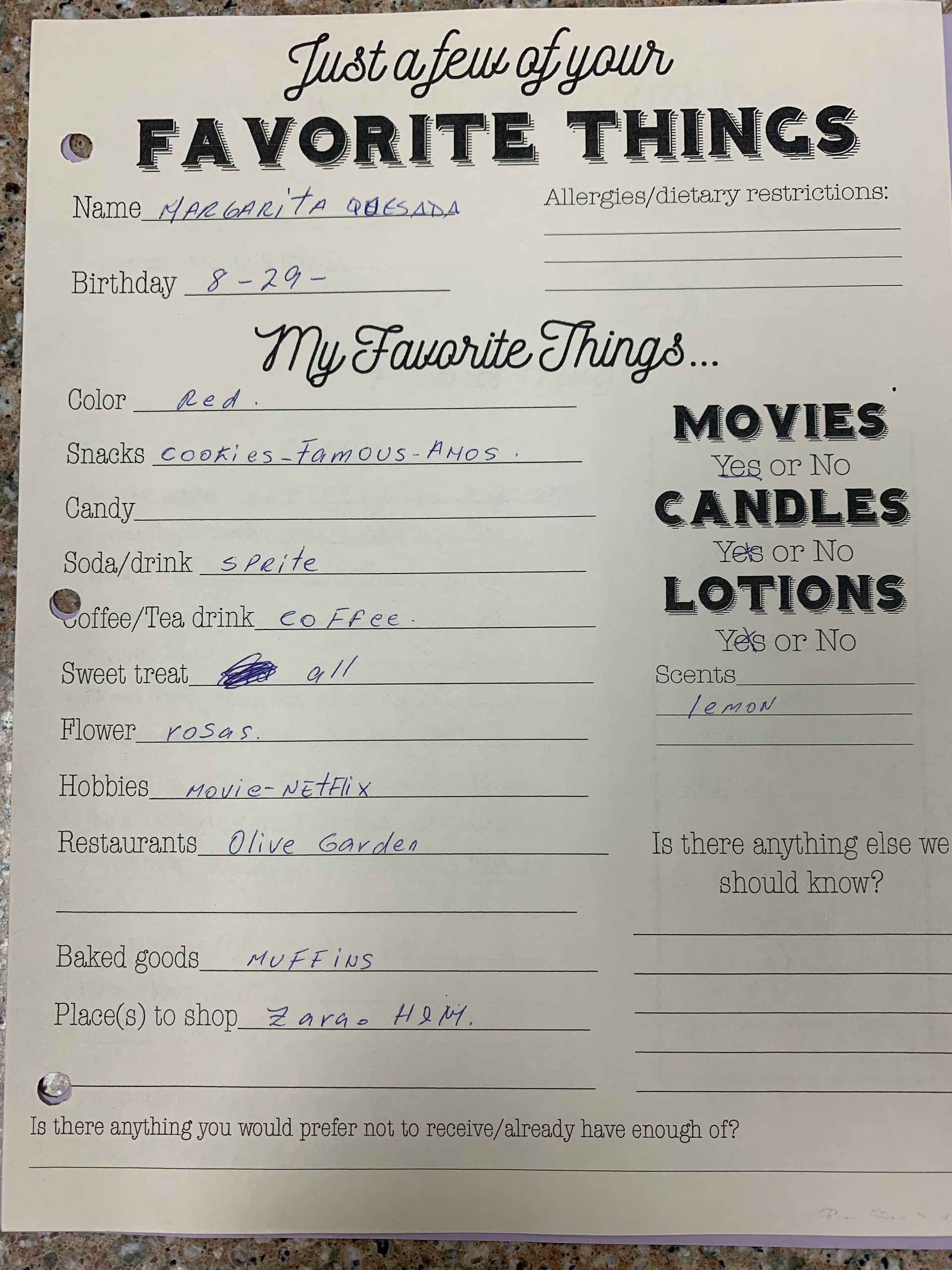 Handwritten “Favorite Things” worksheet with sections for movies, candles, lotions, and snacks on a white page