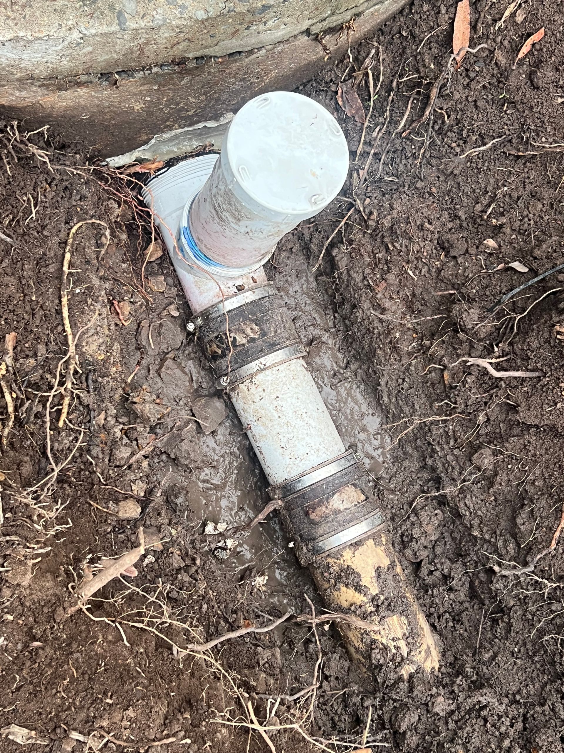 A White PVC Plumbing Cleanout Pipe — Chris Murphy Plumbing & Maintenance In Langley Vale, NSW
