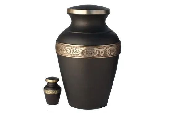 Black decorative urn with a gold patterned band and a small matching urn beside it