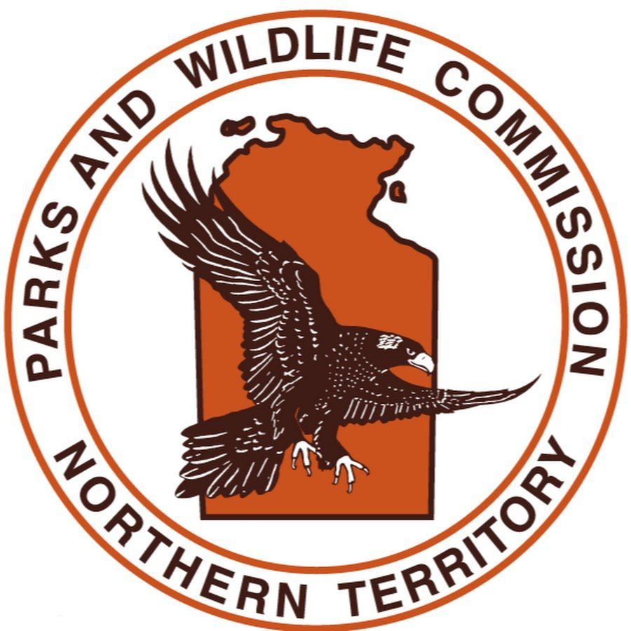 Logo of Parks and Wildlife Commission Northern Territory, featuring a flying bird over an orange outline of the territory.