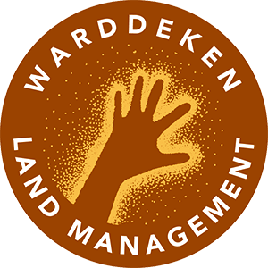 Brown circular logo with text 