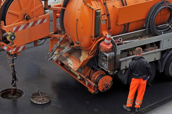 A crew member demonstrating septic cleaning in Duluth, MN