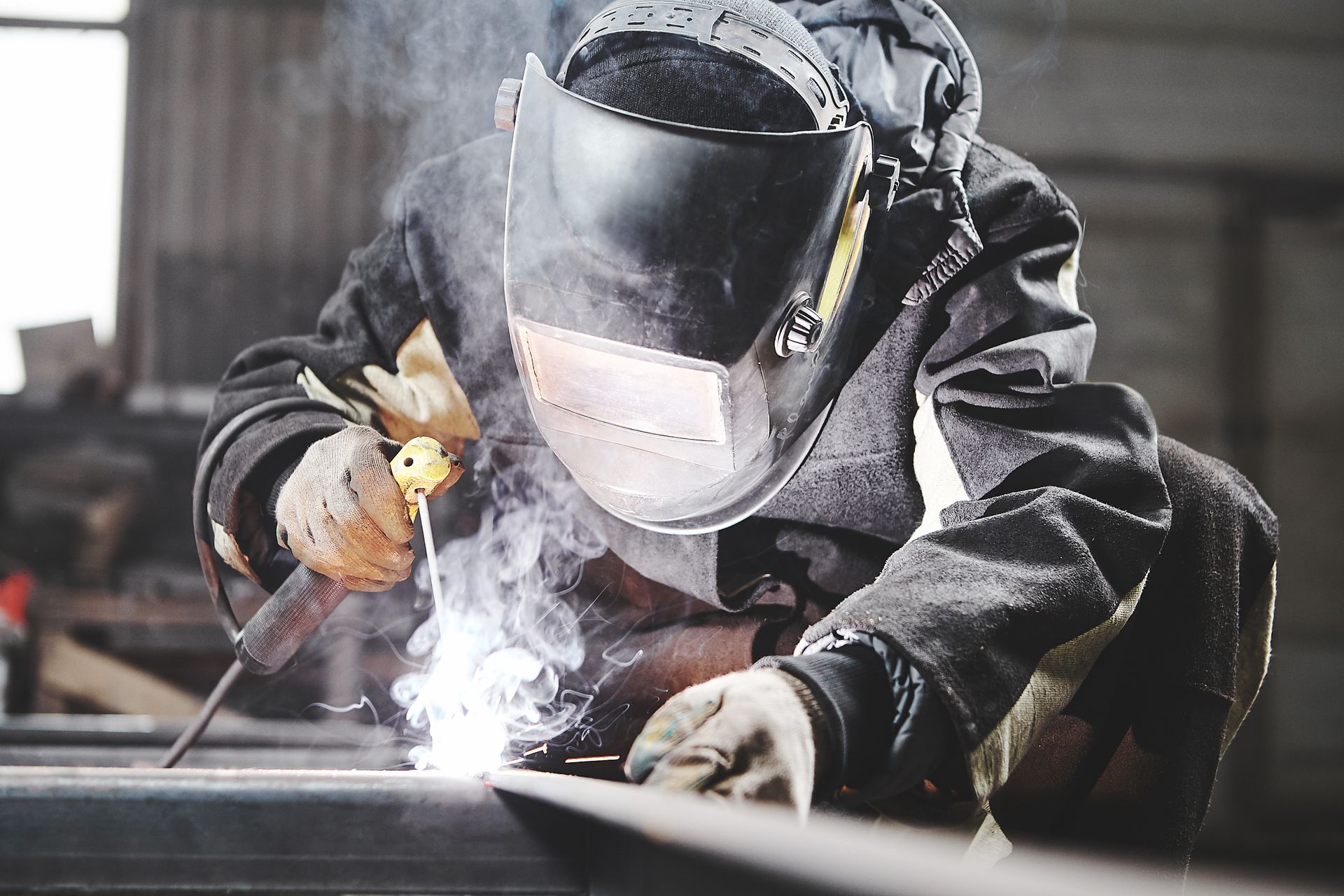 An industrial worker in Stratmoor constructing metal frames