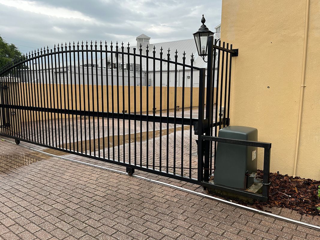motor for automatic sliding gate with metal frame in front for protection from collisions