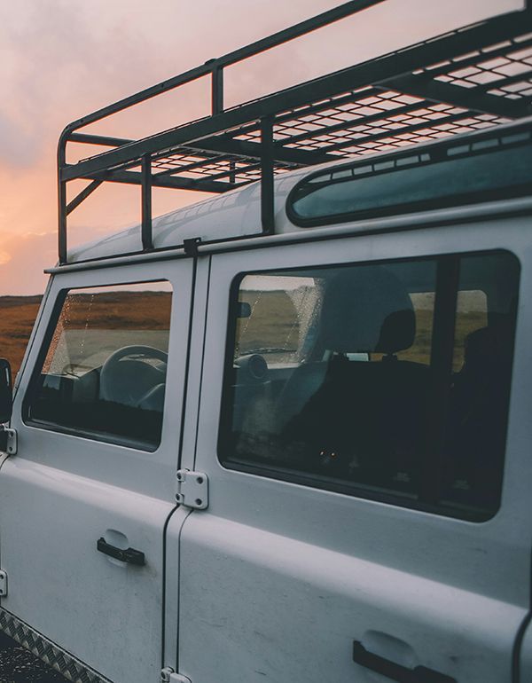 rack mounted on roof of jeep for extra equipment storage