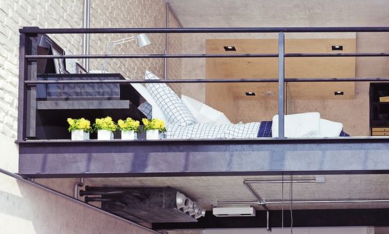 Contemporary metal handrail in the loft of a modern apartment