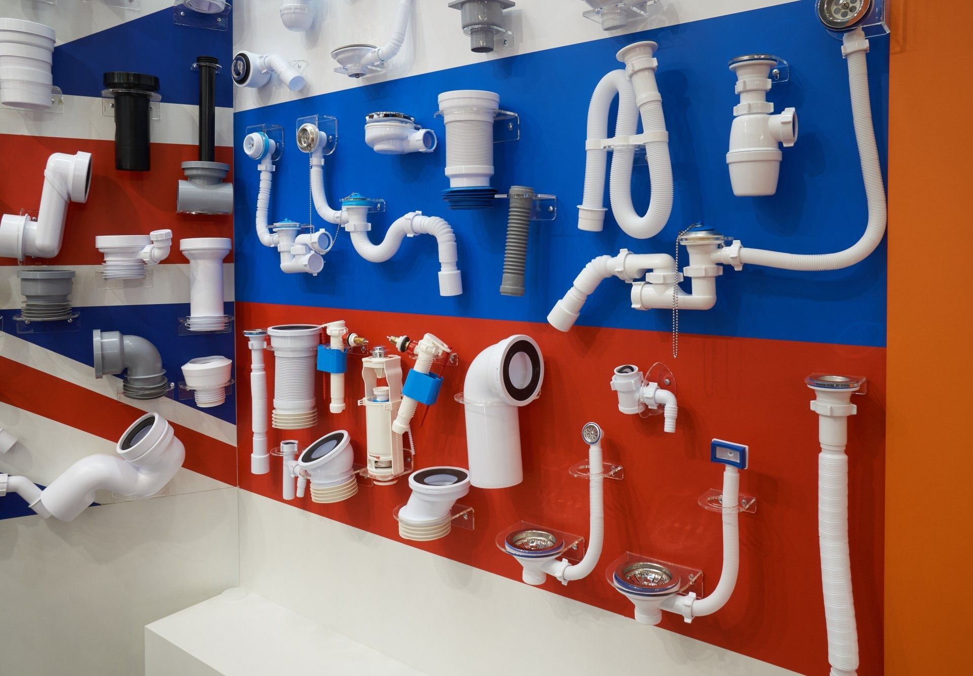 Plumbing Fixtures Displayed on A Wall with Red, White, and Blue Stripes — Weav Plumbed in Emerald, QLD
