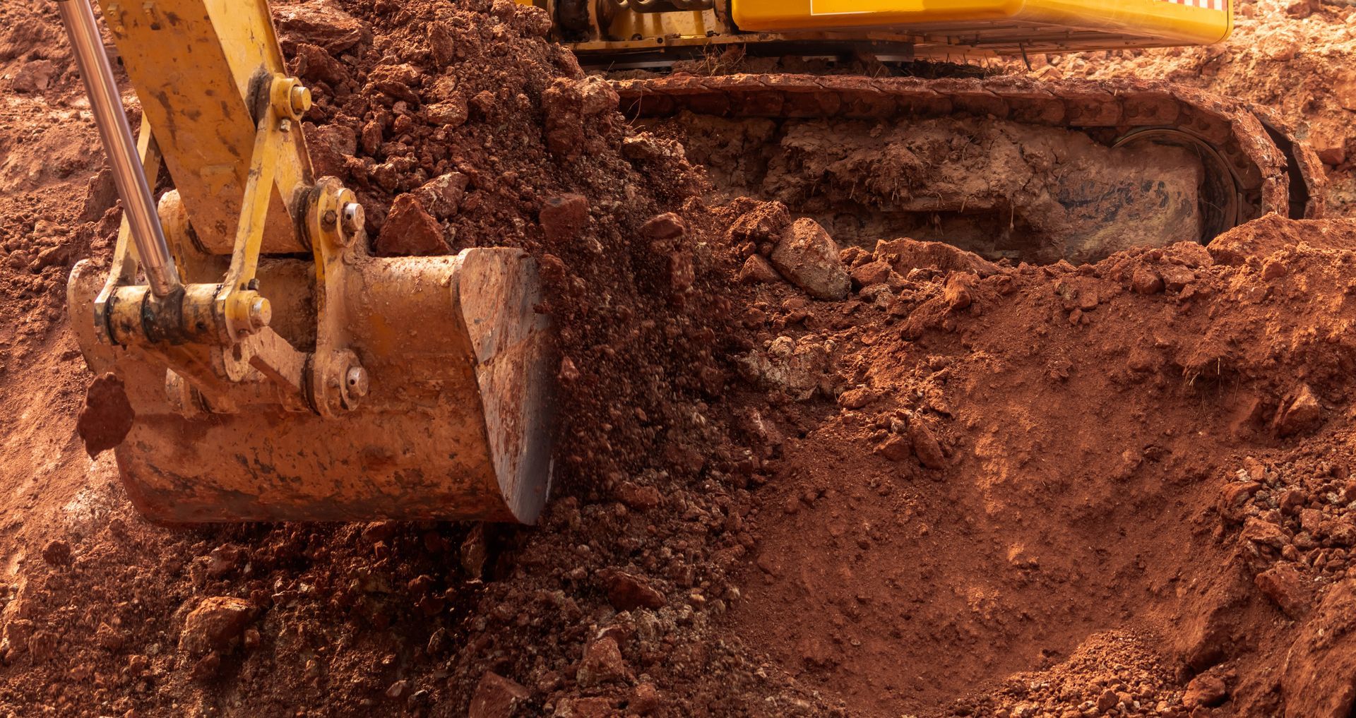 backhoe working by digging soil