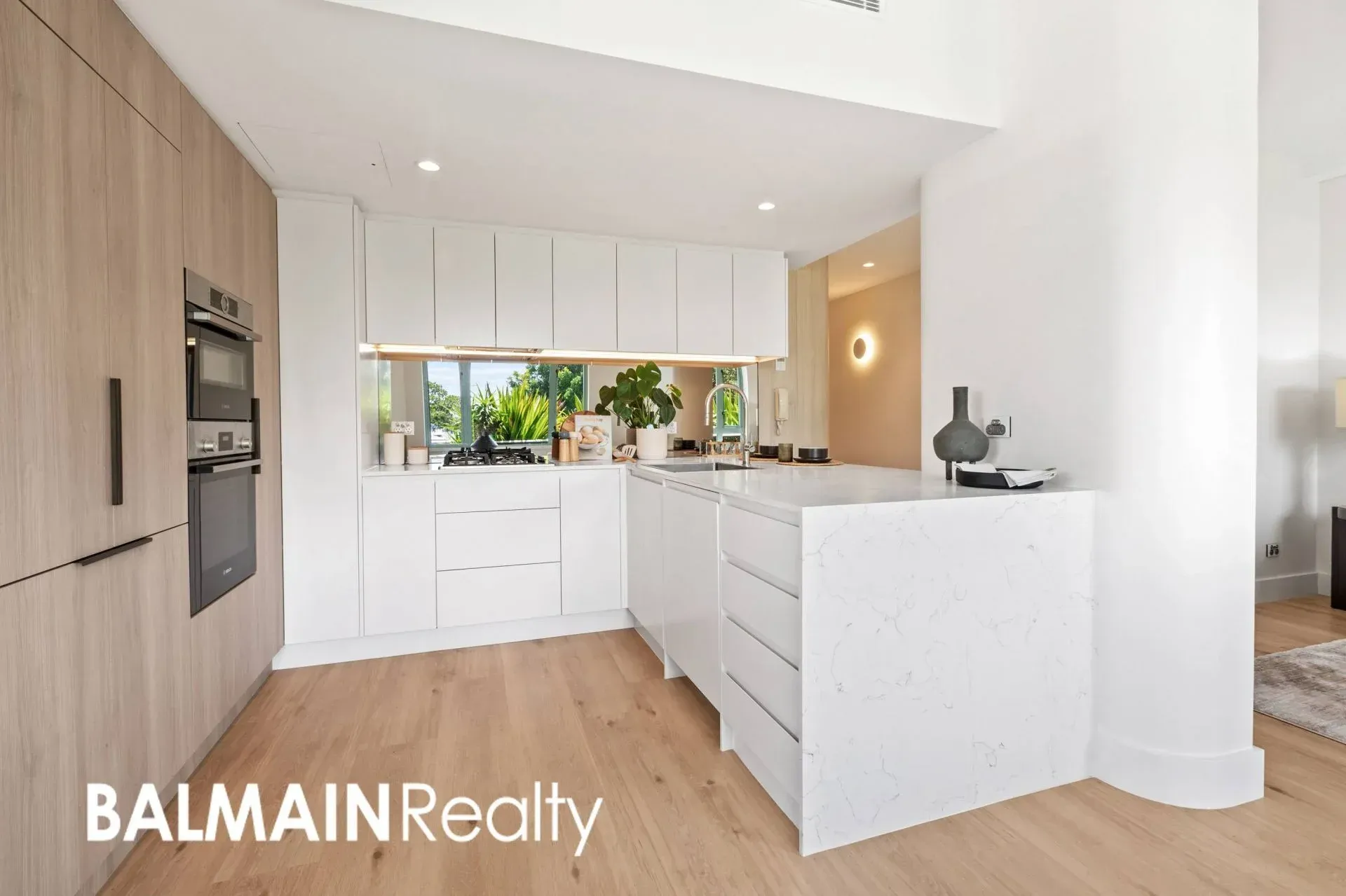 Modern White Kitchen With Wooden Cabinets — ATH Projects in Drummoyne, NSW